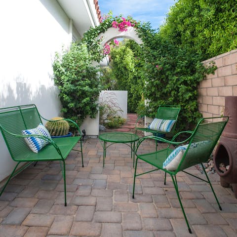 Escape to the garden hideout by the firepit