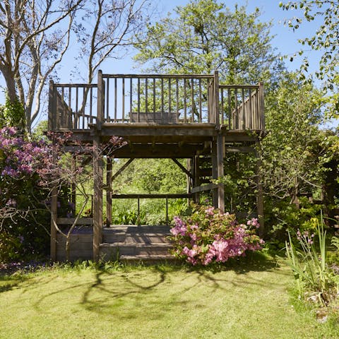 Look out to sea from the elevated terrace amongst the trees 