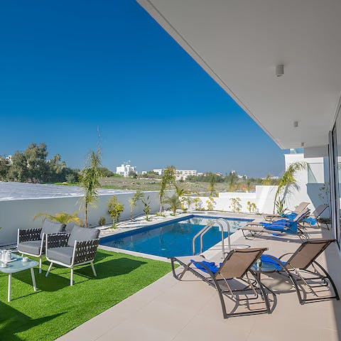 Doze off on a lounger after bobbing about in the private pool