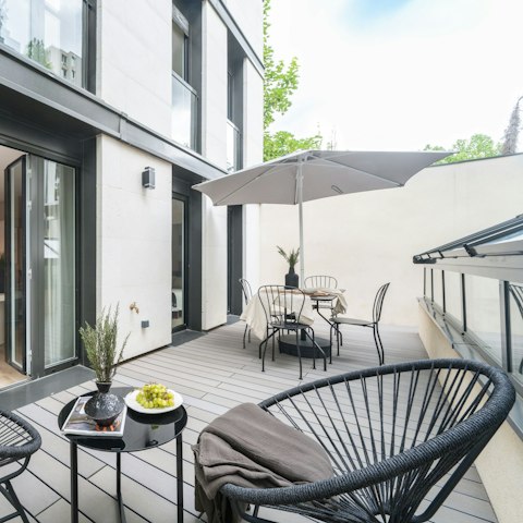 Sip cocktails on the terrace before going out to dinner in the Marais