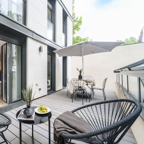 Sip cocktails on the terrace before going out to dinner in the Marais