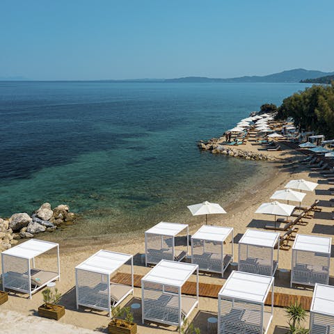 Pad down to the private beach, exclusively for those staying at your resort