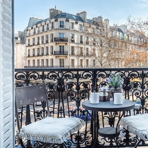 Lap up the views of the boulevard, as Paris passes you by on the streets below