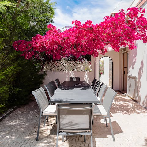 Choose between shade and the sun at the partially-covered alfresco table