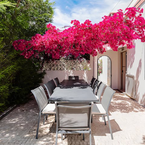 Choose between shade and the sun at the partially-covered alfresco table