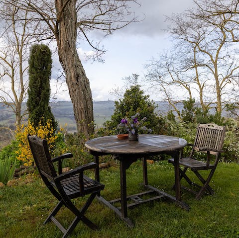 Share a bottle of wine from the castle's vineyard and watch the sunset over the hills