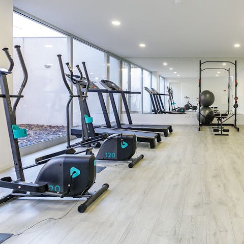 Stay on top of your fitness goals with a workout in the well-equipped communal gym