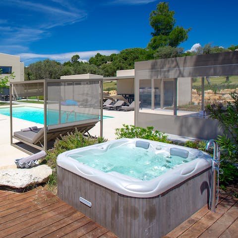 Watch the sun set over the cove from the hot tub