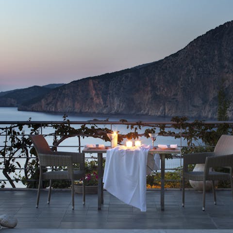 Dine by sunset overlooking the Ionian Sea