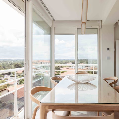Enjoy homemade bacalao al pil pil at the dining table with lovely views