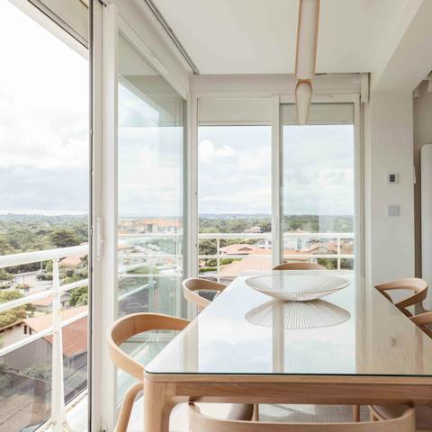Enjoy homemade bacalao al pil pil at the dining table with lovely views