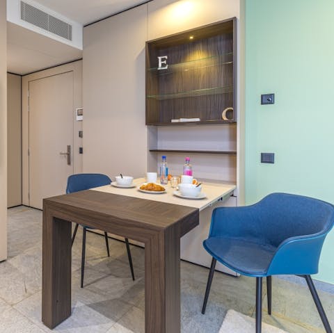 Tuck into delicious homecooked meals around the pull-out dining table