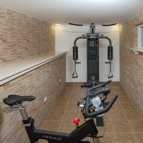 Work up a sweat in your home gym, then freshen up beneath the outdoor shower