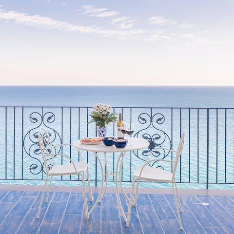 Savour a glass of wine on the terrace and admire the sweeping sea views