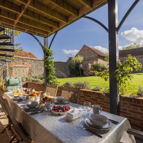 Cook on the Weber barbecue and feast on the upper or lower dining terrace