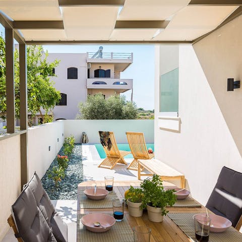 Escape the sunshine and dine alfresco in the roofed barbecue area