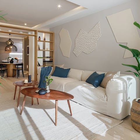 Kick back with a glass of wine in the stylish living room after a day of exploring the city