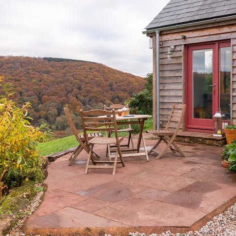 Dine outdoors with a panoramic view of the valley beneath you