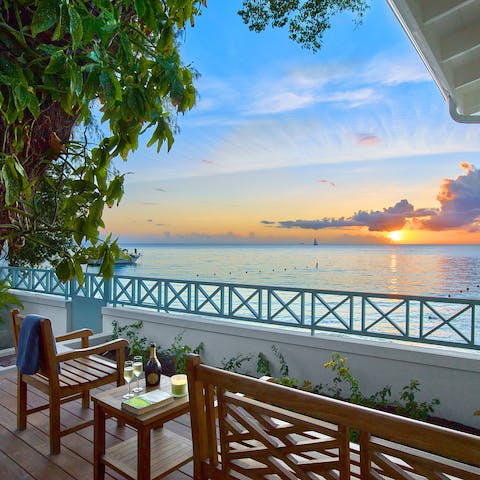 Sip cocktails as you drink in the beautiful sunsets from the deck