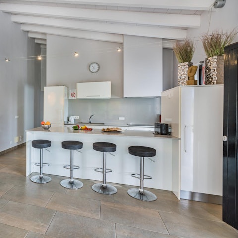 Cook in the modern kitchen or dine out in nearby Puerto Pollensa