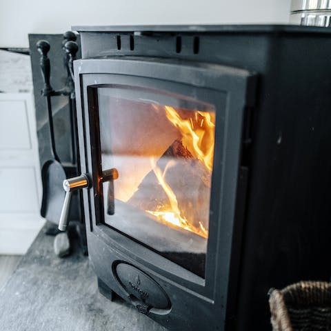 Snuggle up on the sofas by the log-burning stove