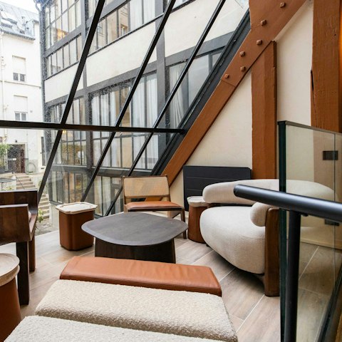 Curl up with morning coffee in the light-filled atrium space
