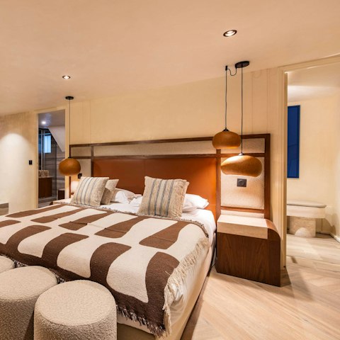 Drift off to sleep in the high-style, king-sized bedrooms