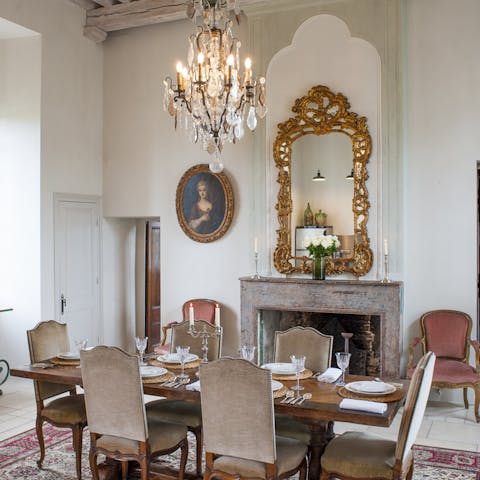 Dine in elegance beneath the chandelier