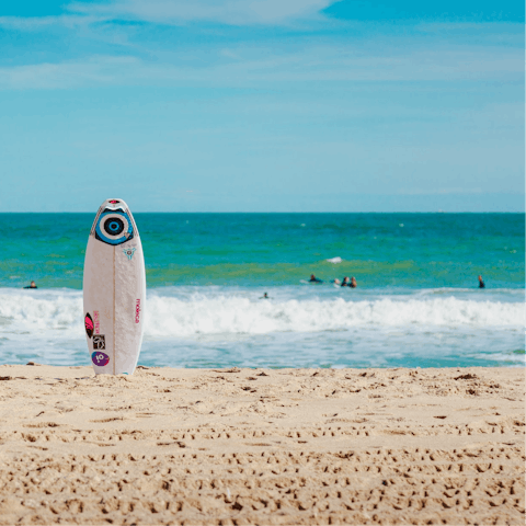 Sink your toes into the sand at Melbourne Beach, just steps away