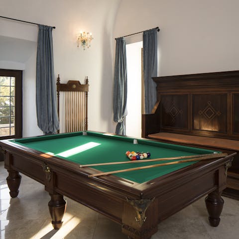 Shoot some snooker in the games room