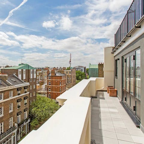 Watch the day break over London's skyline from your private balcony