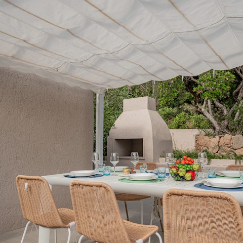 Gather for a barbecue night on the shaded patio