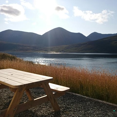 Watch the sunset from the waterfront picnic table