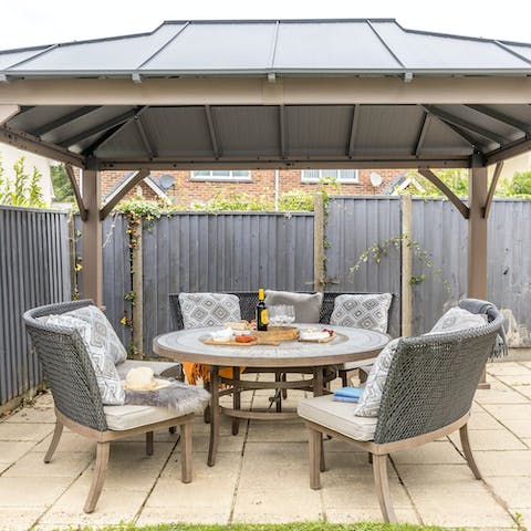 Enjoy a charcuterie board and a glass of bubbly in the garden