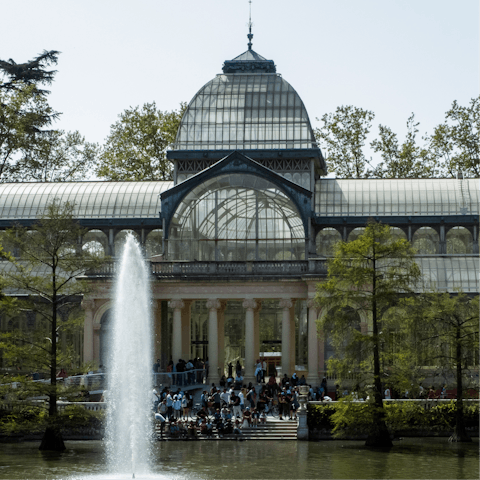 Stroll around El Retiro Park and the Palacio de Cristal, just a few steps away