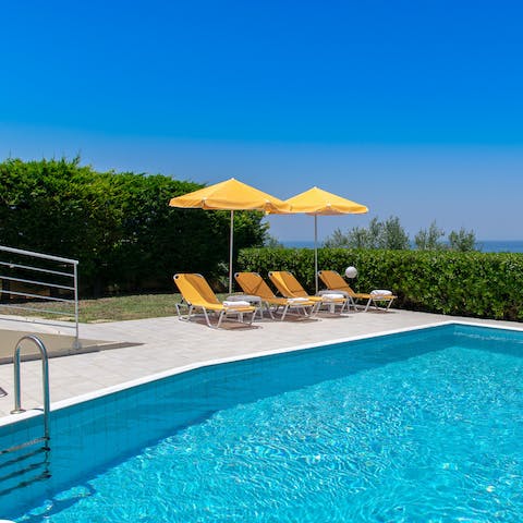 While away sun-soaked afternoons topping up your tan by the pool