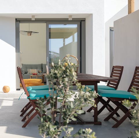 Share alfresco meals and Greek wine in the outdoor dining area