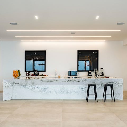 Try out some new recipes in the sleek marbled kitchen