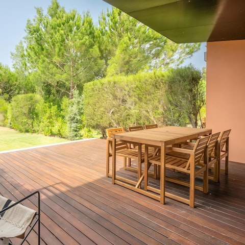 Eat outside among pines with the garden stretching ahead