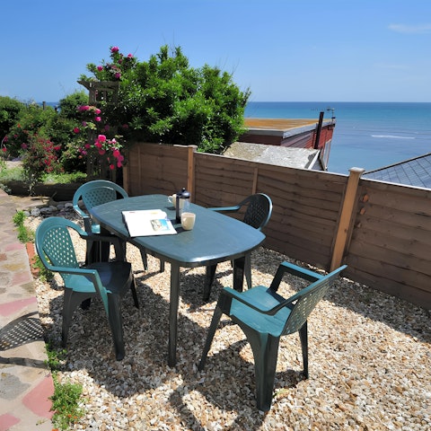 Dine alfresco as you enjoy the sounds of the sea