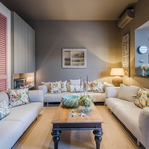 Sink into the sumptuous sofa to relax with a good book and a glass of wine