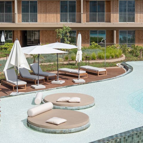 Relax in the Algarve sun by the shared infinity pool
