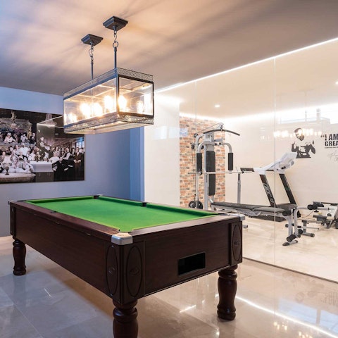 Squeeze in a workout or play pool in the basement gym and games room