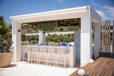 Pull up a stool at the outdoor bar to sample some cocktails
