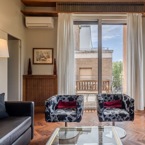 Admire the quirky design touches like the cow print chairs