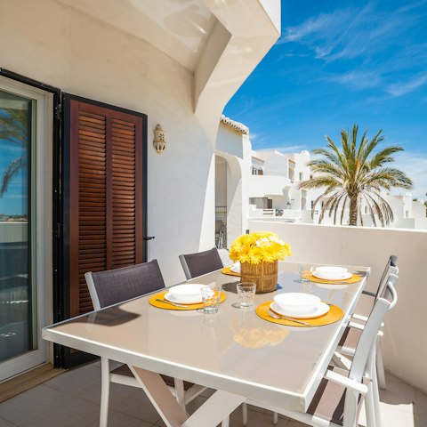 Sit out for meals on your sunny balcony
