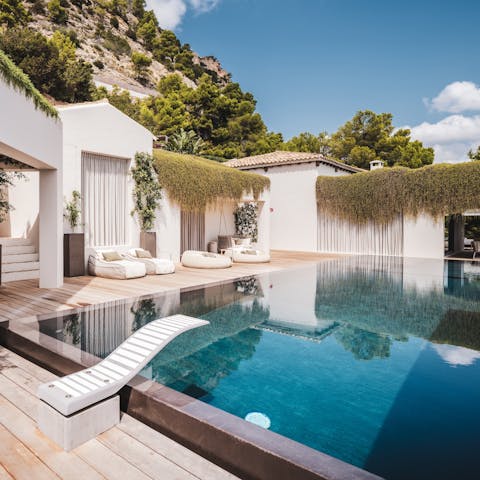 Gaze out to sea as you swim in the private pool