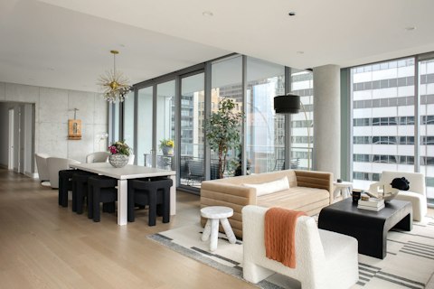 Spread out across a light-filled living and dining area with city views
