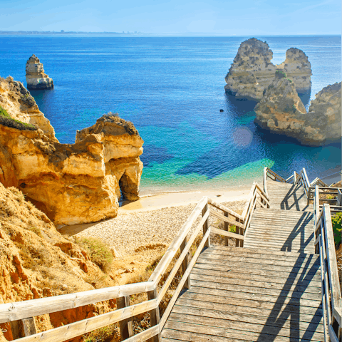 Sunbathe on the soft white sand of Praia de Alvor – it's a ten-minute drive