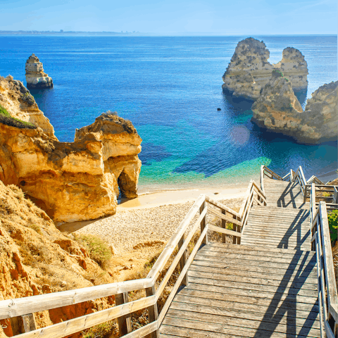 Sunbathe on the soft white sand of Praia de Alvor – it's a ten-minute drive